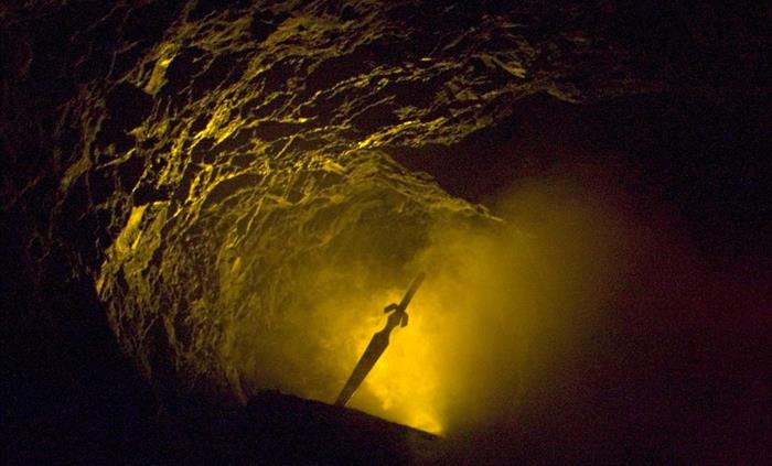 The sword in the stone at King Arthur's Labyrinth in Mid Wales.